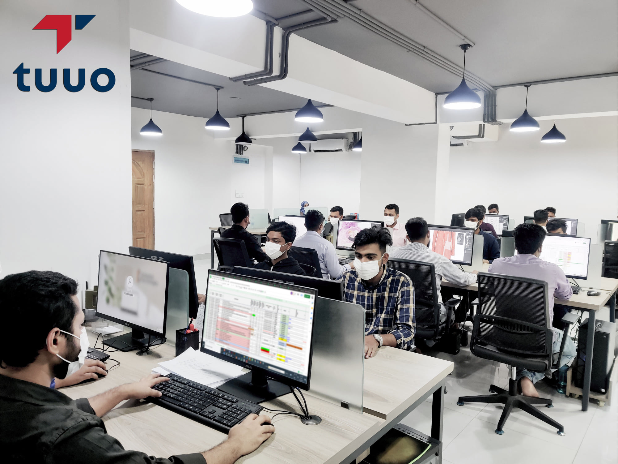 Modern office workspace with clean desks and natural light